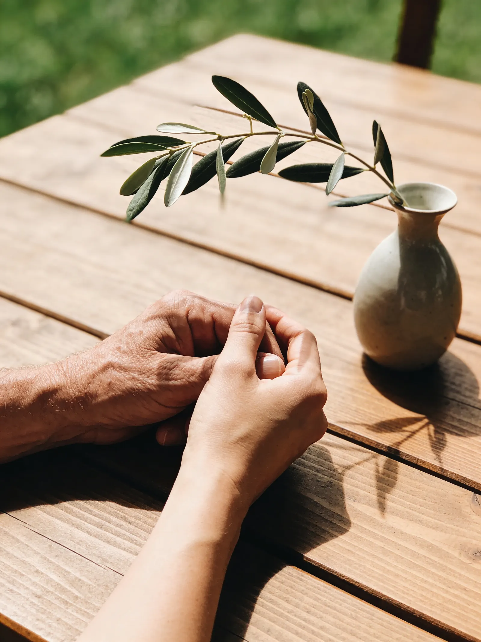 Several family hands resting together